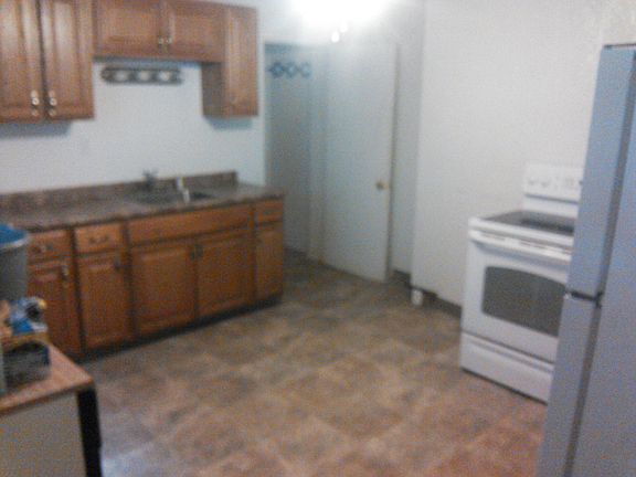 Older photo. Flooring has been replaced / no appliances