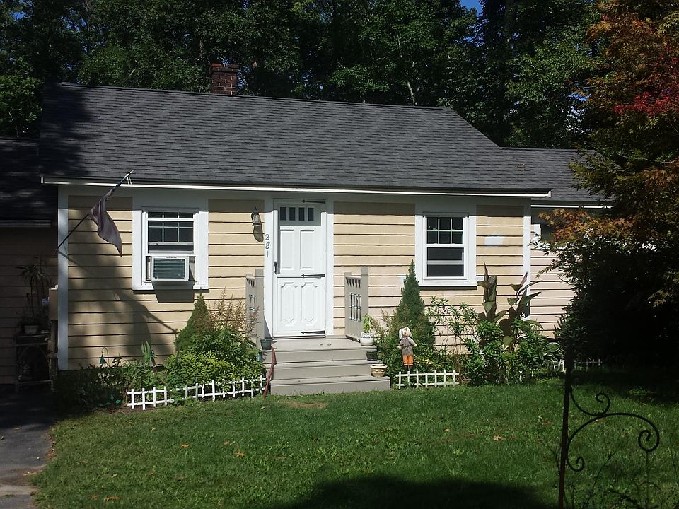 Front entrance with parking area to the left.