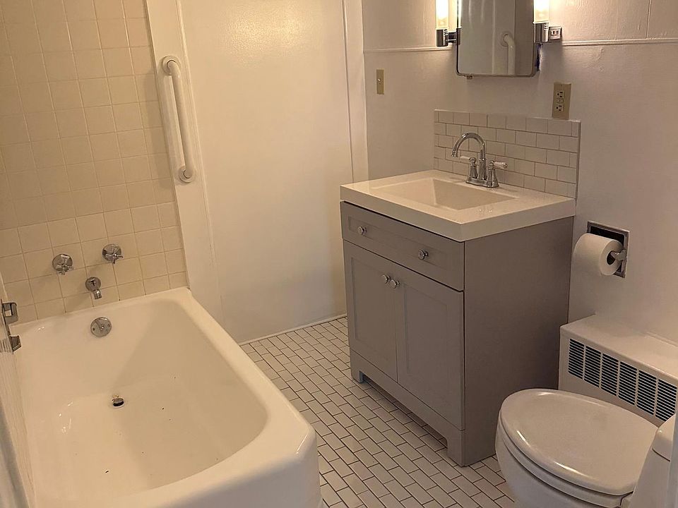 Tub just re- enameled, new tile floor, new sink and cabinet.