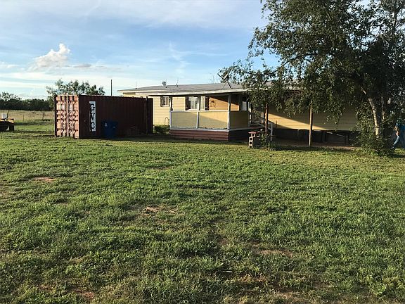 Back w patio and storage