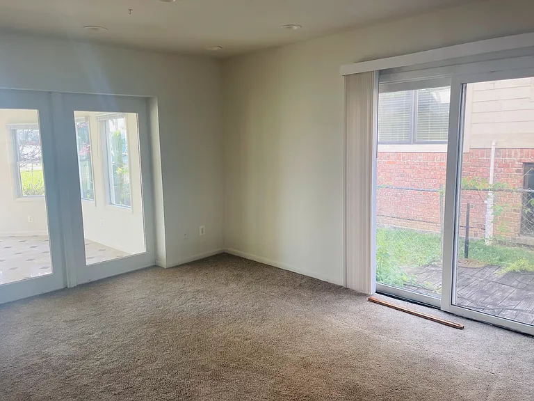 Living Room. You can see into the 4-seasons room and out the sliding door to the fenced side yard