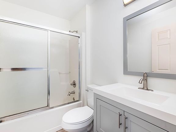 Updated bathroom - new vanity, toilet, lighting.