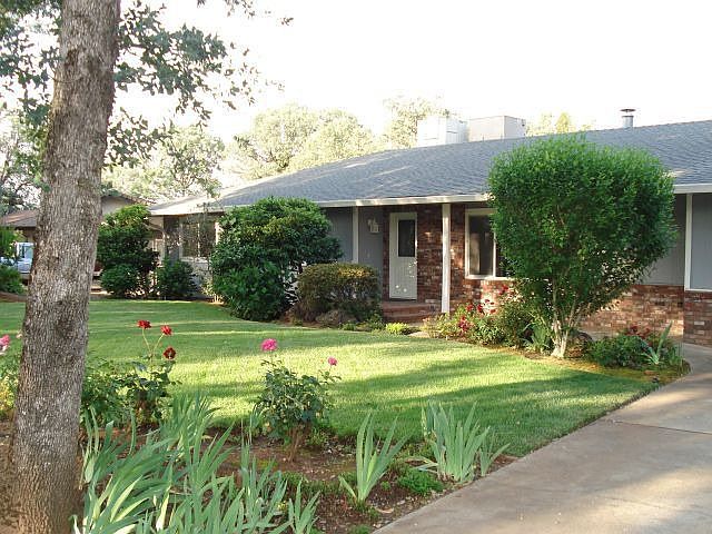 Charming home in wooded acres.