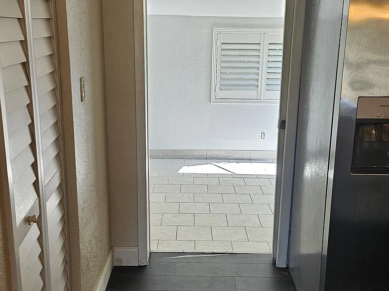 entrance from kitchen to master notice the pocket door
