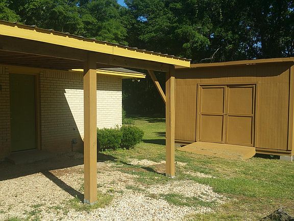 Closeup carport and shed