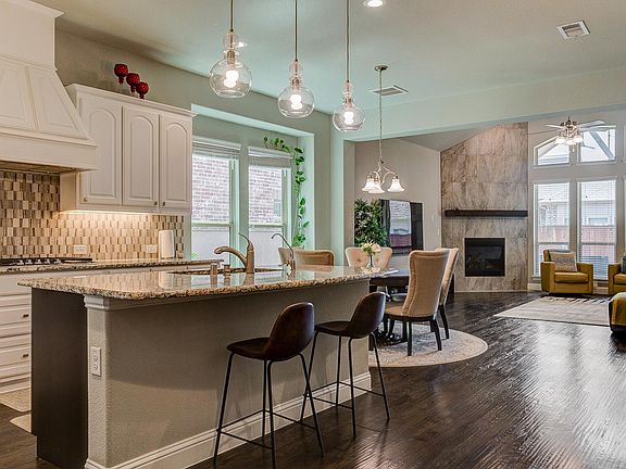 Corner fireplace and plenty of windows for natural lighting