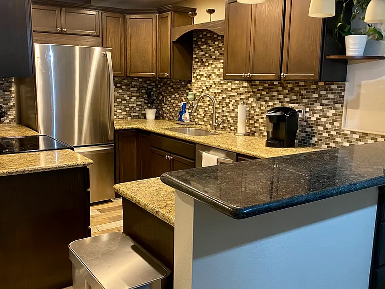 Stainless steal appliances. Solar light in kitchen for natural light.