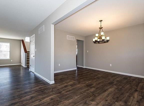 View of Dining Room from Entry.  Newer flooring through out main level and freshly painted.