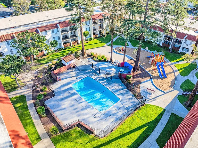 Lively community hub with pool and play areas.