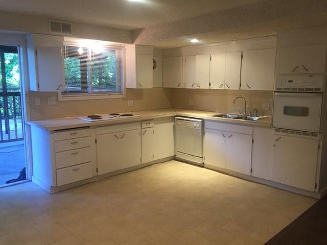 Large, eat- in kitchen with new fridge and dishwasher.