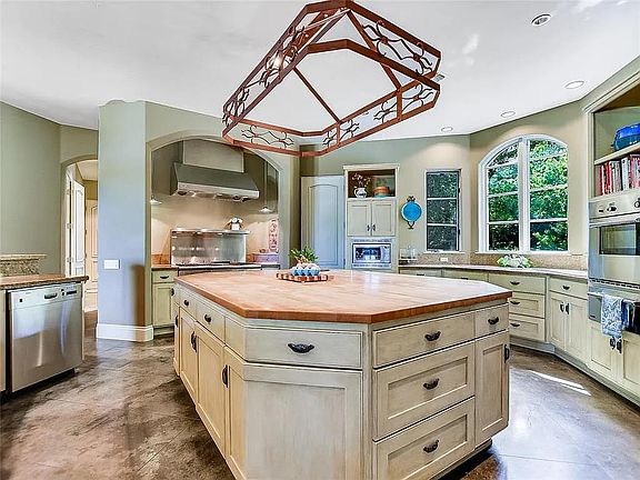 Large chef's kitchen with massive butcher block island