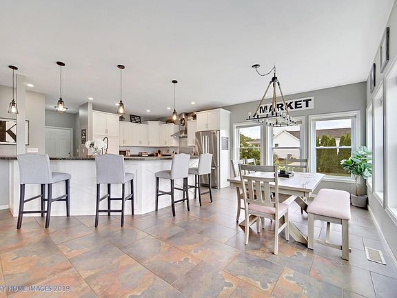 Tile floors flow throughout the expansive kitchen and breakfast room.