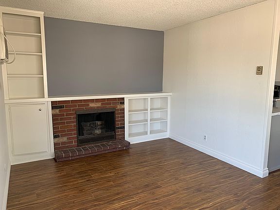 Living room with built-ins and faux fireplace