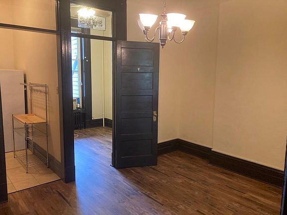 View from dining room into bedroom and kitchen