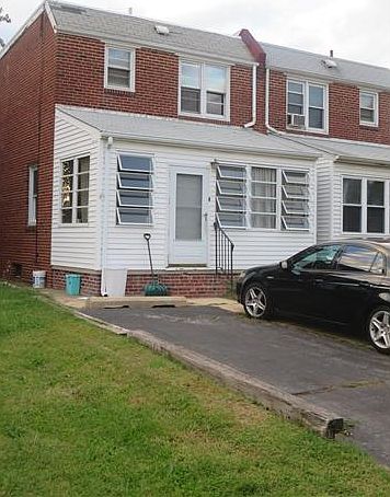 Front of home with enclosed porch