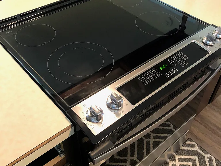 KITCHEN HAS STAINLESS STEEL APPLIANCES. THERE IS NO BUILT IN MICROWAVE BUT UPON REQUEST WILL SUPPLY A COUNTERTOP MICROWAVE.