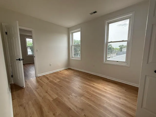 bedroom, natural bright location, new flooring