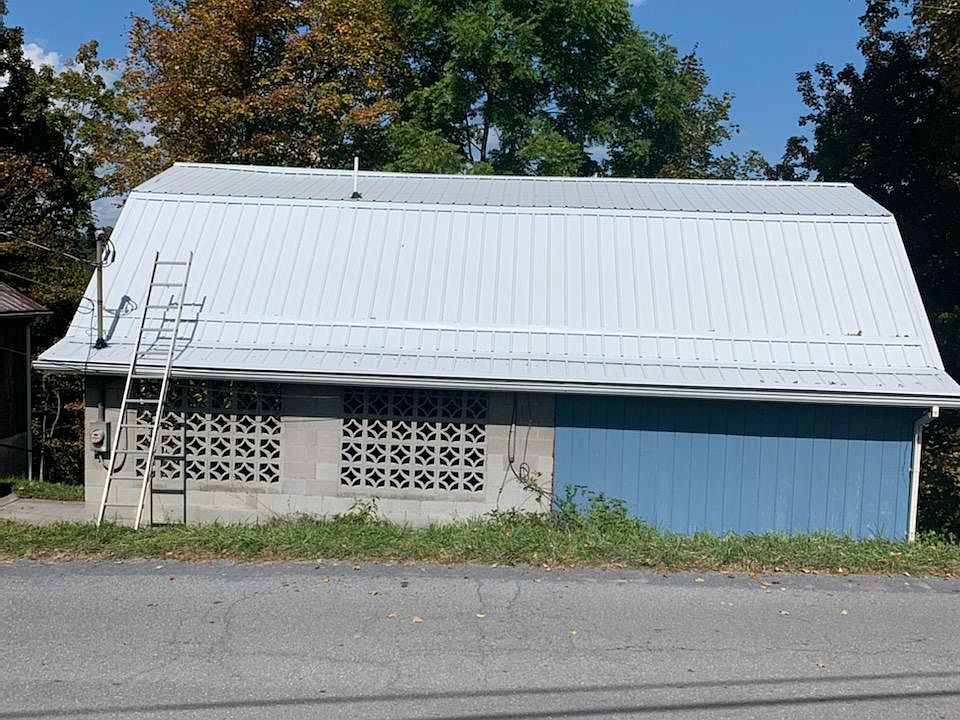 Side view of house with new metal roof