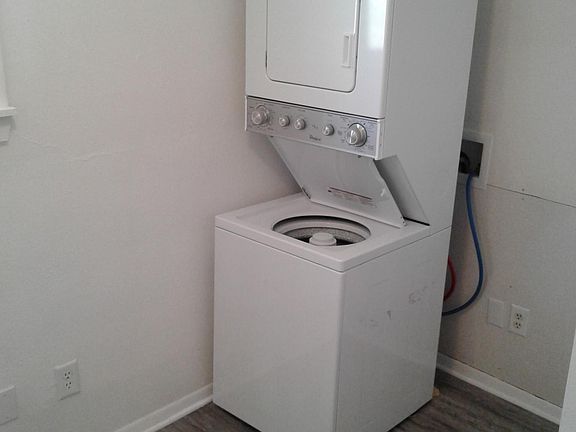 Laundry room with washer and dryer and extra closet