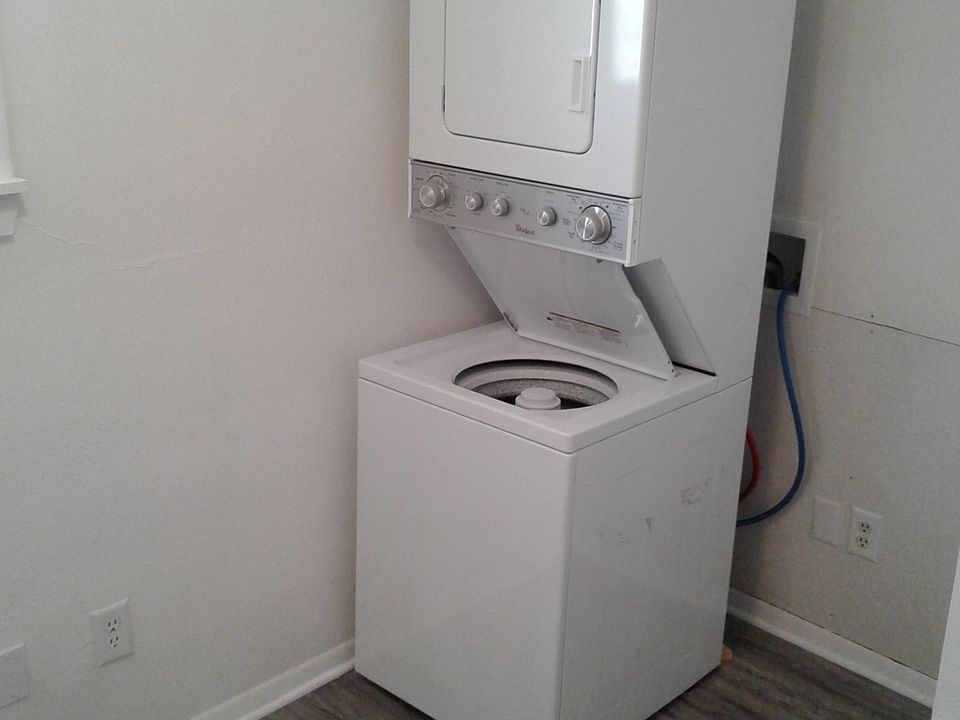 Laundry room with washer and dryer and extra closet