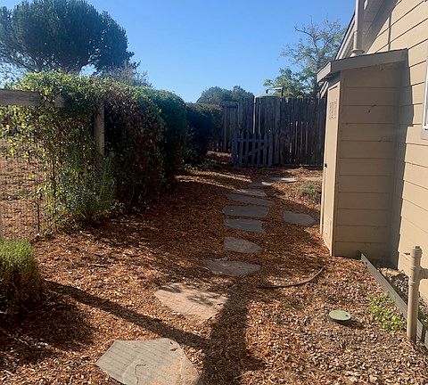 Unit 3 Side Yard to Backyard - Maintained by Landscaper