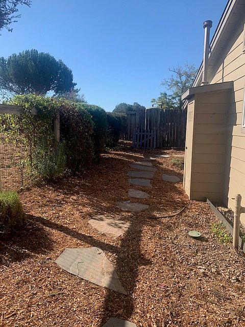 Unit 3 Side Yard to Backyard - Maintained by Landscaper