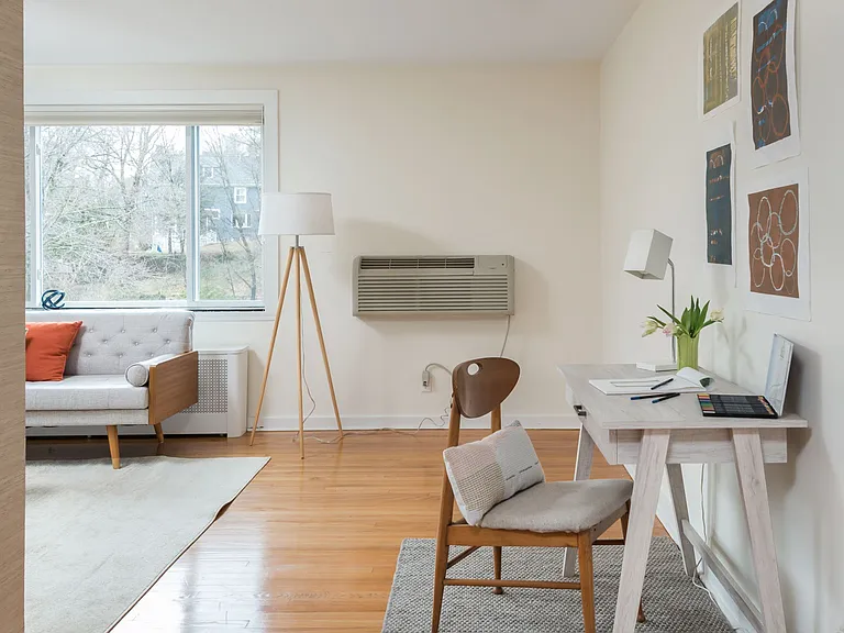 Living room with a desk area