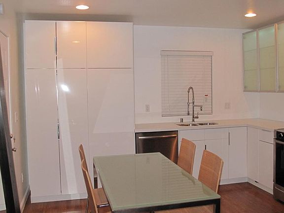 Gloss White European Cabinets With Caesarstone Countertops