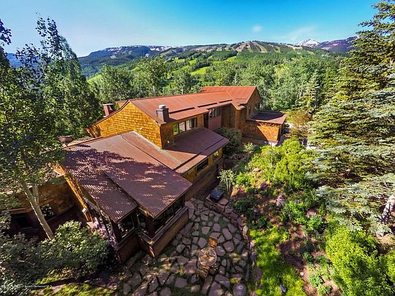 Aerial of Home with Ski Trails Beyond
