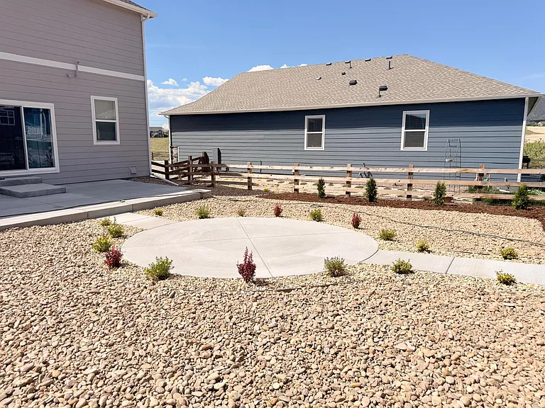 Another view of backyard Patios and landscaping