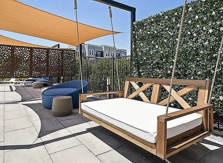 A swing that's built for scrolling, chatting, or doing absolutely nothing. Right next to sleek cabanas and serious style.