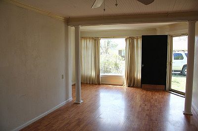 Living room.  Tongue & Groove Ceiling.  Laminate flooring. 