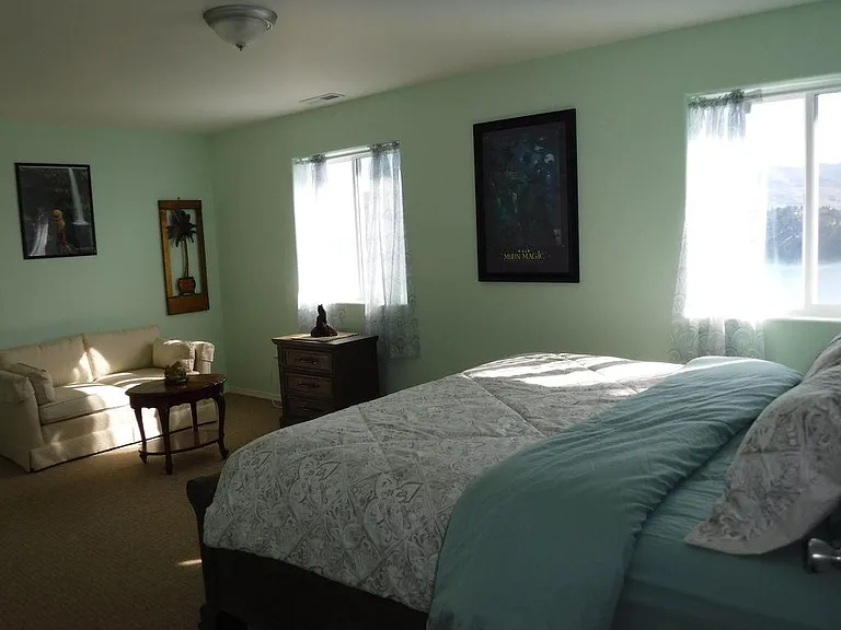 Bedroom two with a king and sitting area.