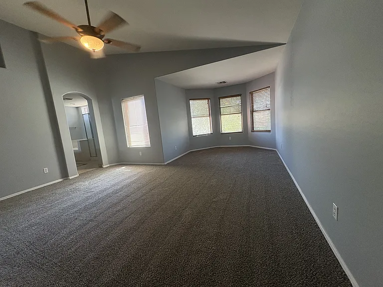 Master Suite with a bay window and a workout area