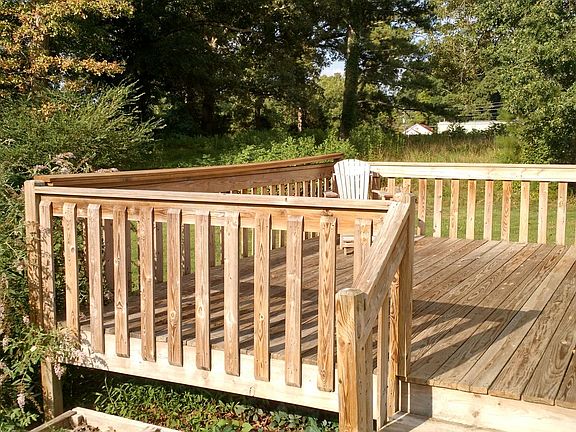 A 12 X 16 deck has full sun during the day but is shaded during the afternoon bu the large oak tree.