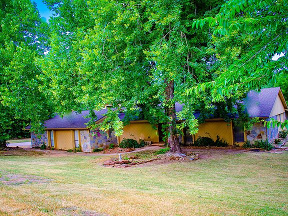 Front yard with mature trees.
