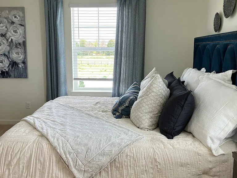 Sample of same floor plan, different finishes, staged with furniture.