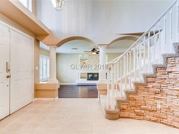 Winding Staircase Welcomes you with Stone Detail