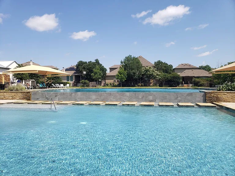 Community pool. Includes 2 pool areas, one of which has swimming lanes, and a splash pad.