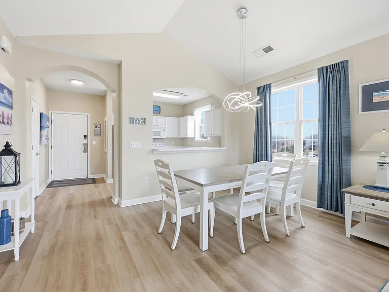 Bright dining area conveniently located next to the full kitchen.