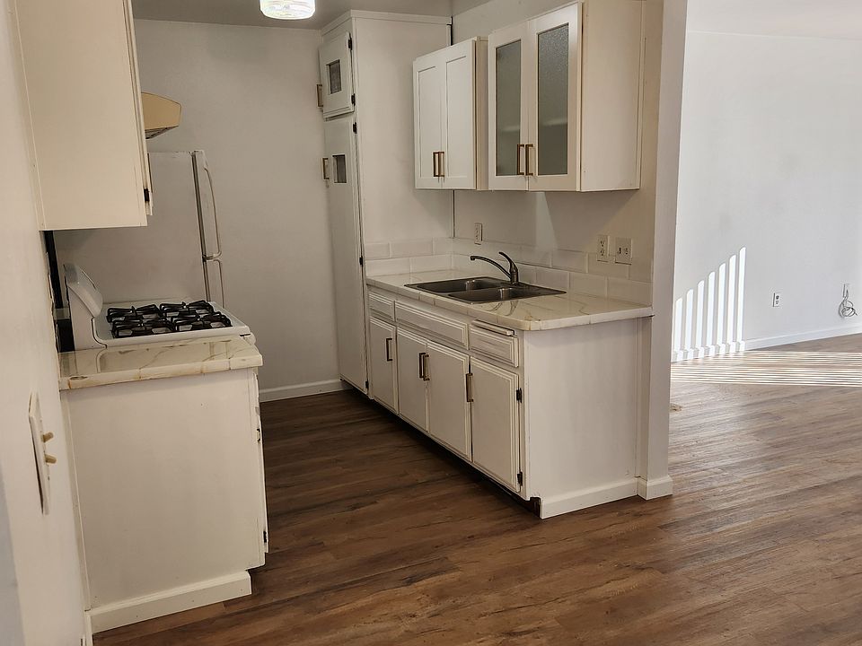 Point of view from the dining area looking at the kitchen.