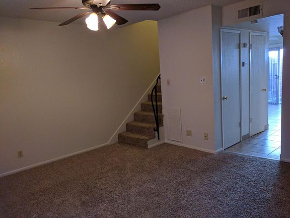 Living room with hall to kitchen. Stairs go up to bedrooms and full bath with tub and shower.