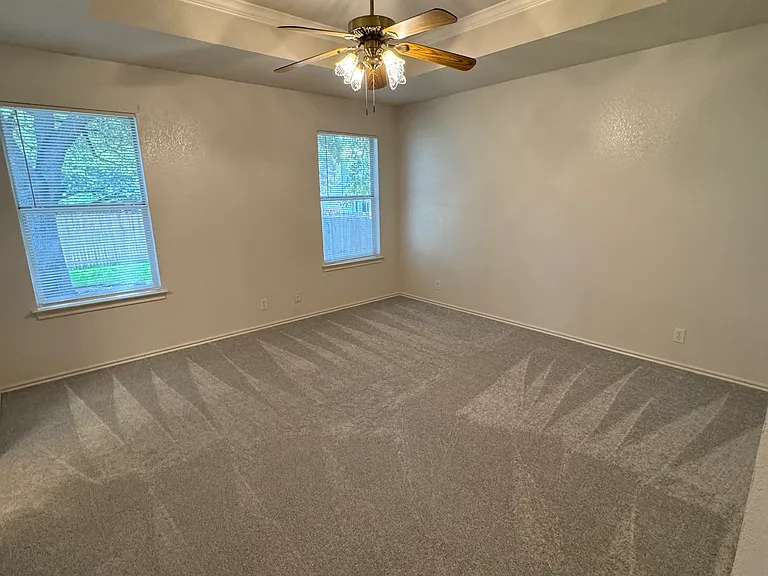 Spacious master bedroom.
Natural light and tray ceiling.