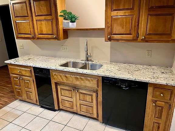 kitchen with new granite and appliances living room