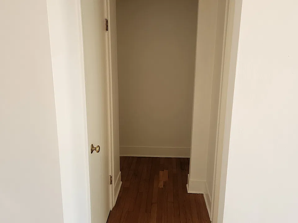 Hallway to bedroom and bathroom with extra closet