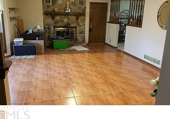 Family Room graced by gleaming ceramic tiled flooring.