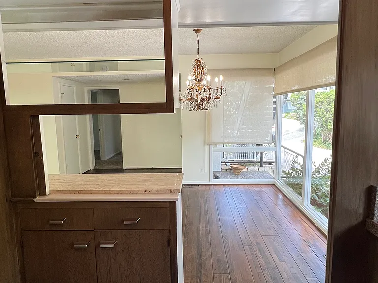 VIEW OF DINING ROOM FROM THE KITCHEN