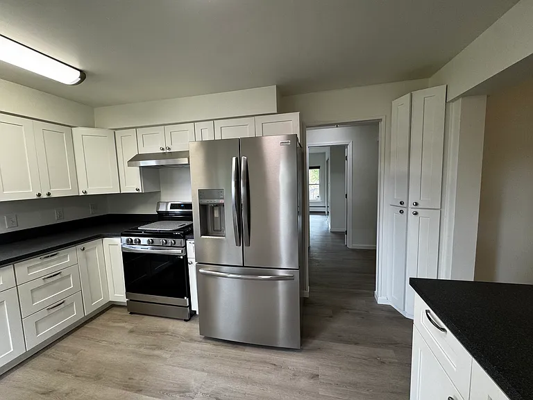 Kitchen looking into hallway.