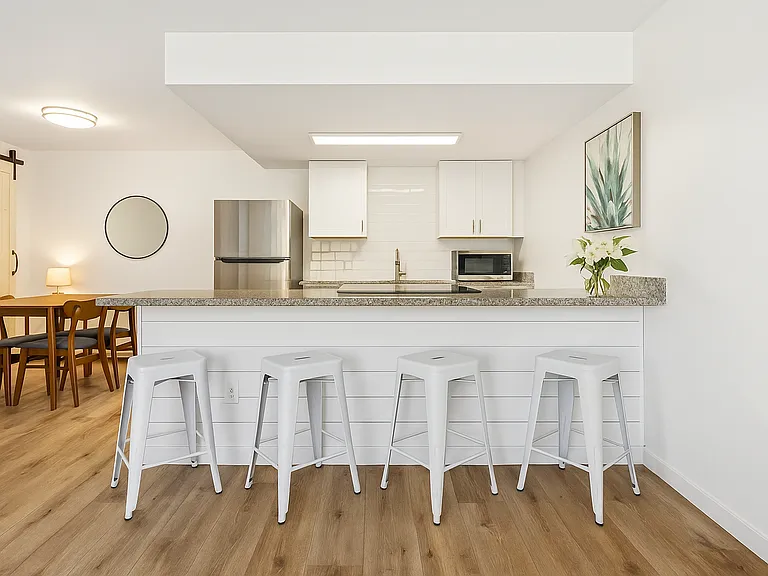 Gather Around the Heart of the Home. Whether it's morning coffee at the bar or dinner with friends at the table, this open-concept space makes every meal feel like a shared moment.