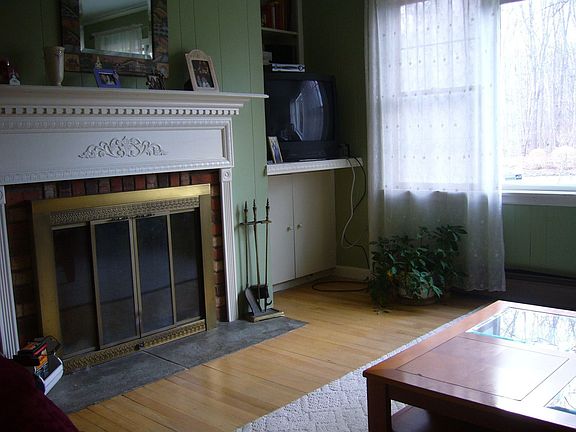 fire place and picture window in living room